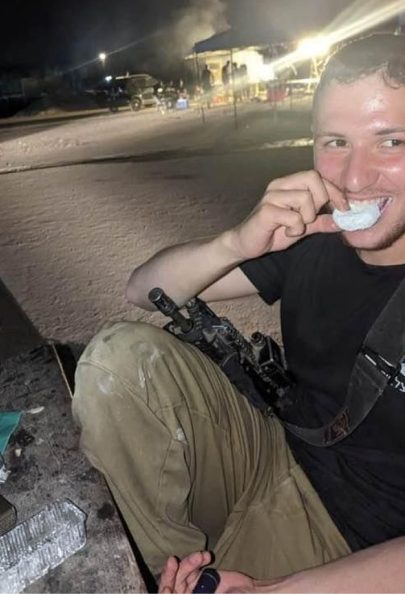 Soldier enjoying an Entemann's donut from the package of treats sent. Soldier enjoying an Entemann's donut from the package of treats sent.